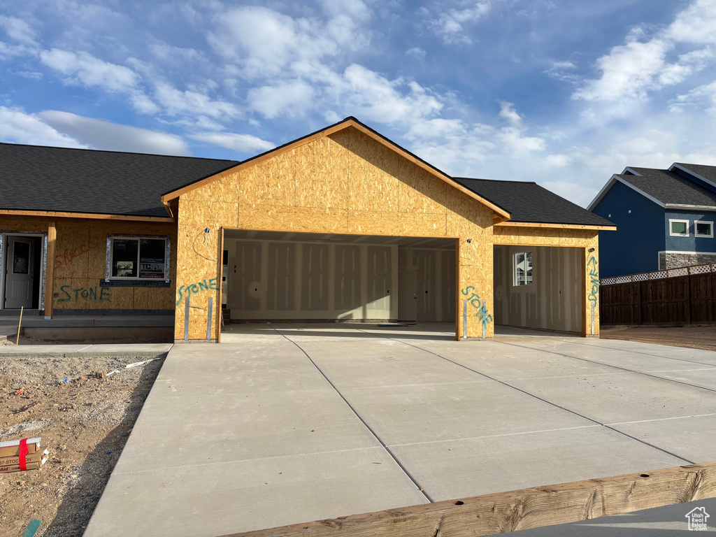 View of front facade featuring a garage