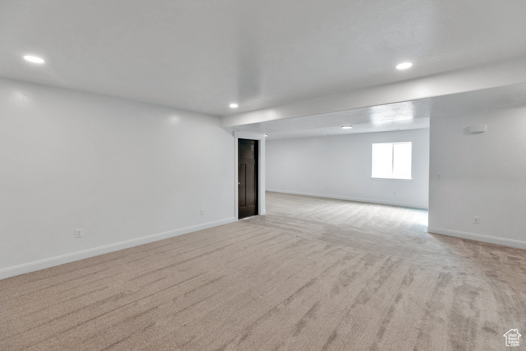 Spare room with light colored carpet