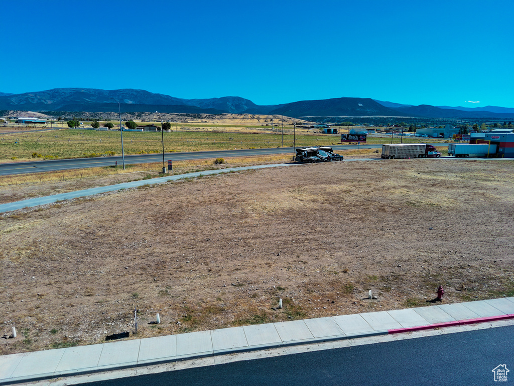 Property view of mountains with a rural view