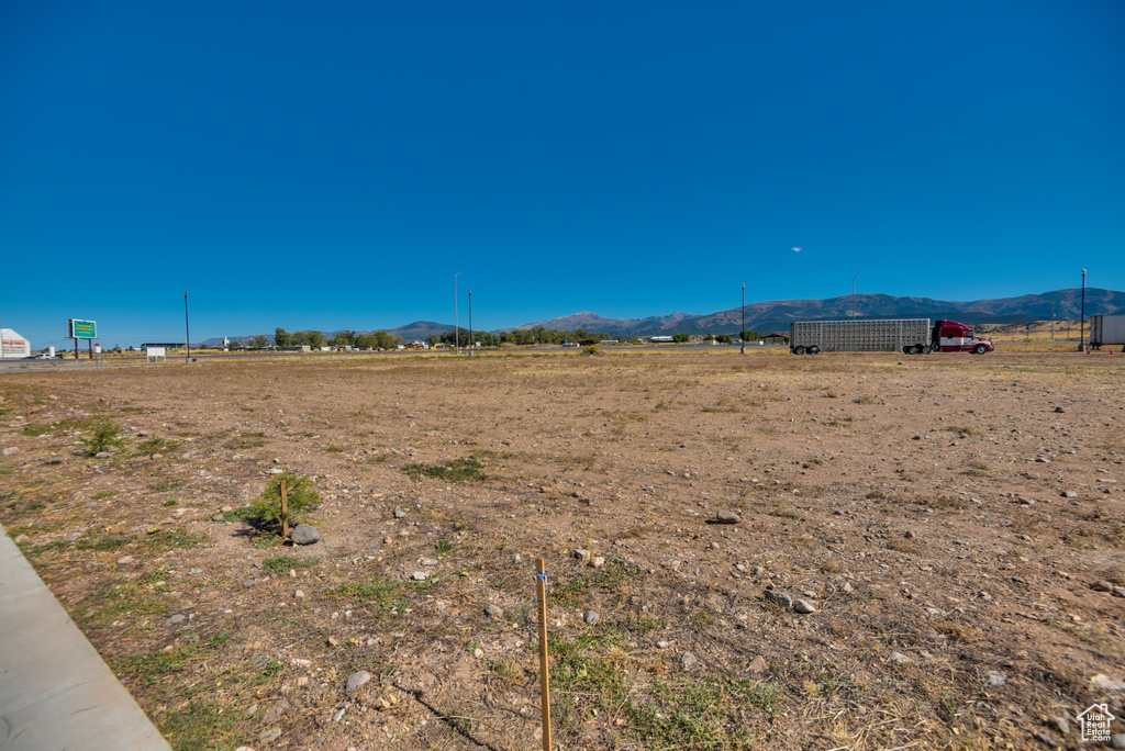 View of yard with a mountain view and a rural view