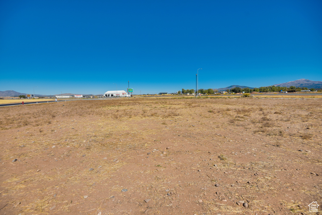 View of yard featuring a mountain view and a rural view