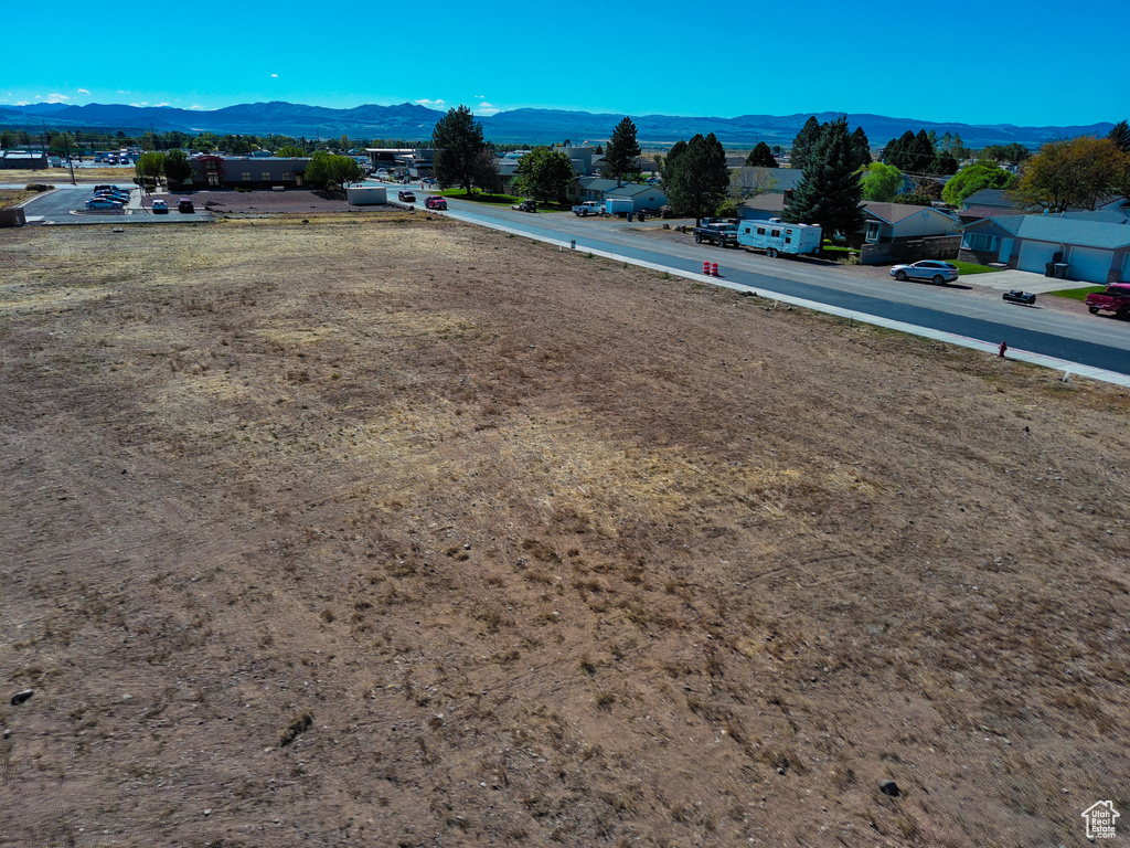 Birds eye view of property with a mountain view