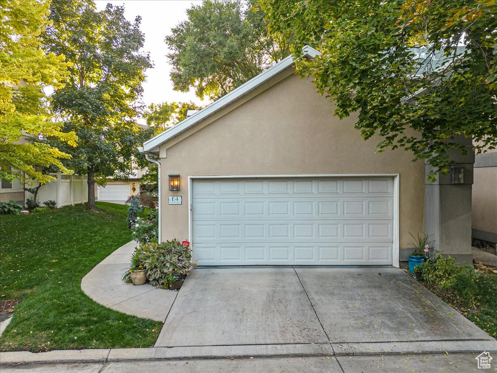 Garage featuring a yard