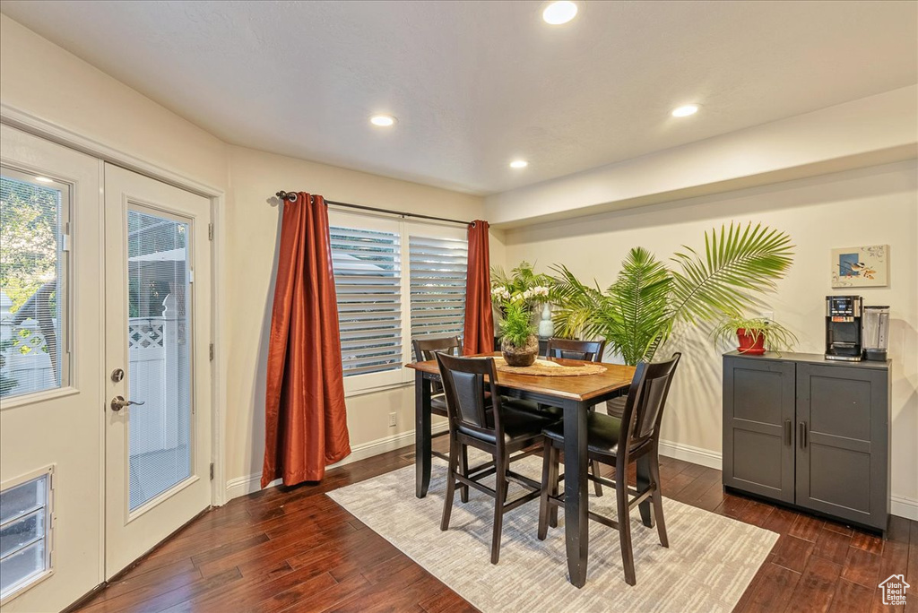 Dining space with french doors and dark hardwood / wood-style flooring