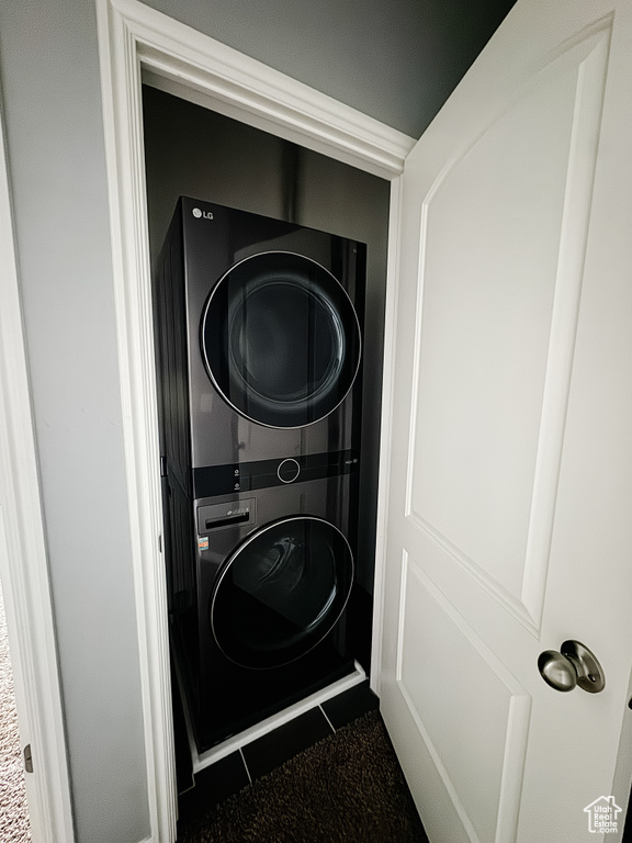 Laundry area featuring stacked washer / dryer