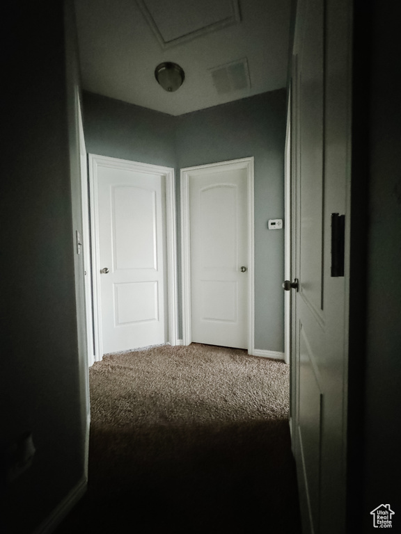 Hallway with carpet floors