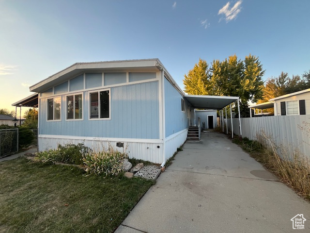 Property exterior at dusk with a carport