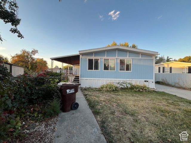 View of front of property featuring a front lawn