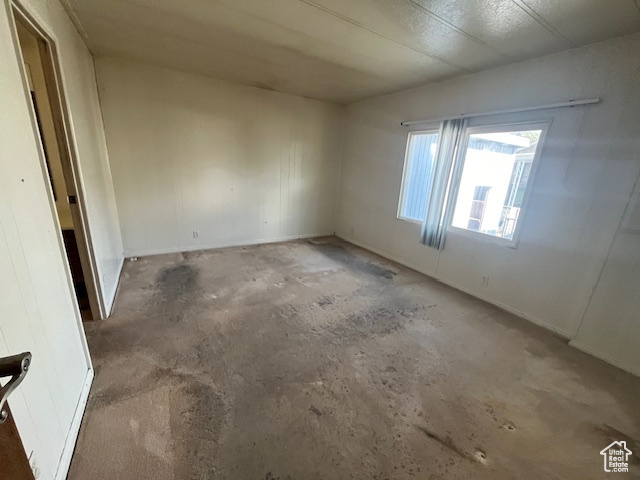 Spare room with concrete floors