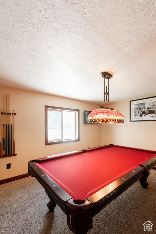 Rec room with pool table, carpet, and a textured ceiling