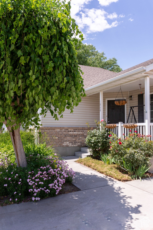 View of side of property with a porch