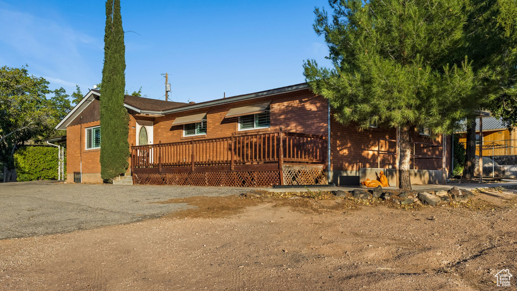 View of front of property featuring a deck