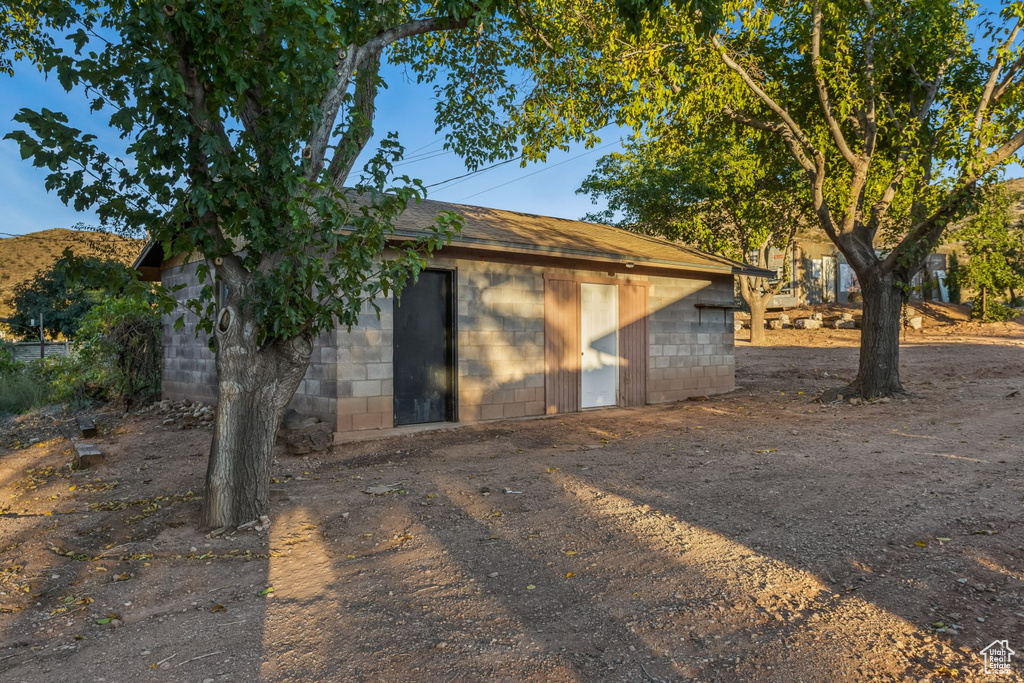 View of outbuilding featuring a garage and a mountain view