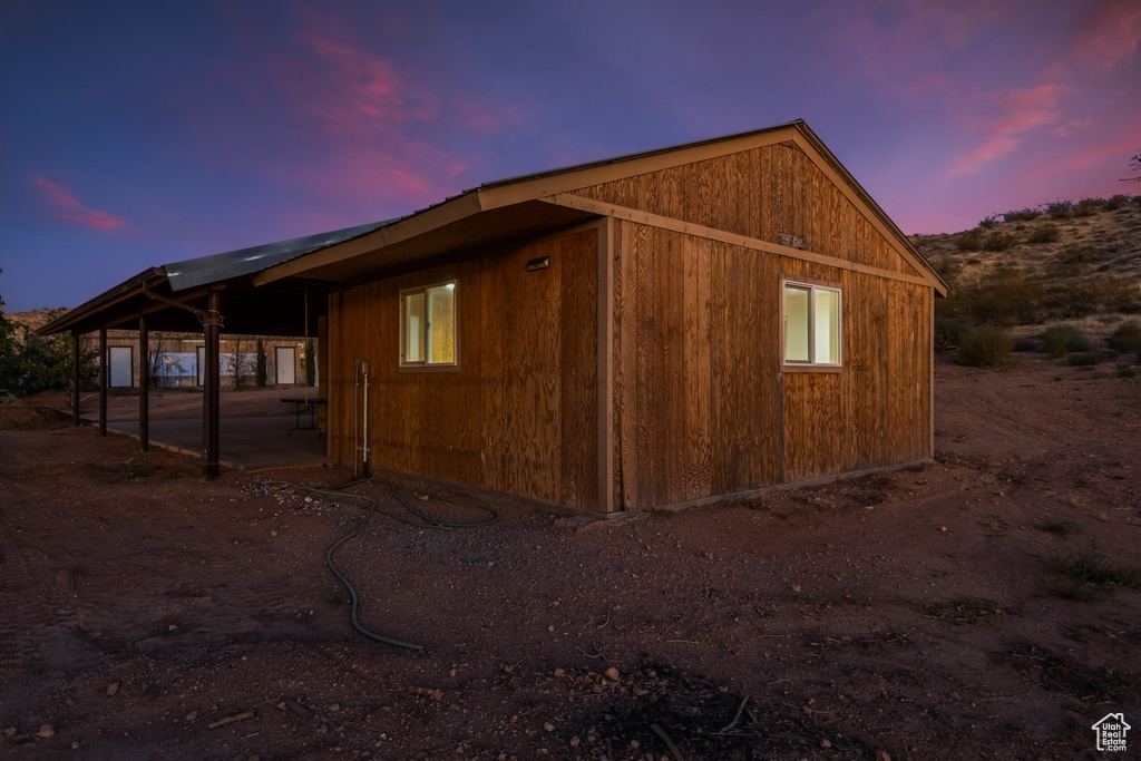 View of property exterior at dusk