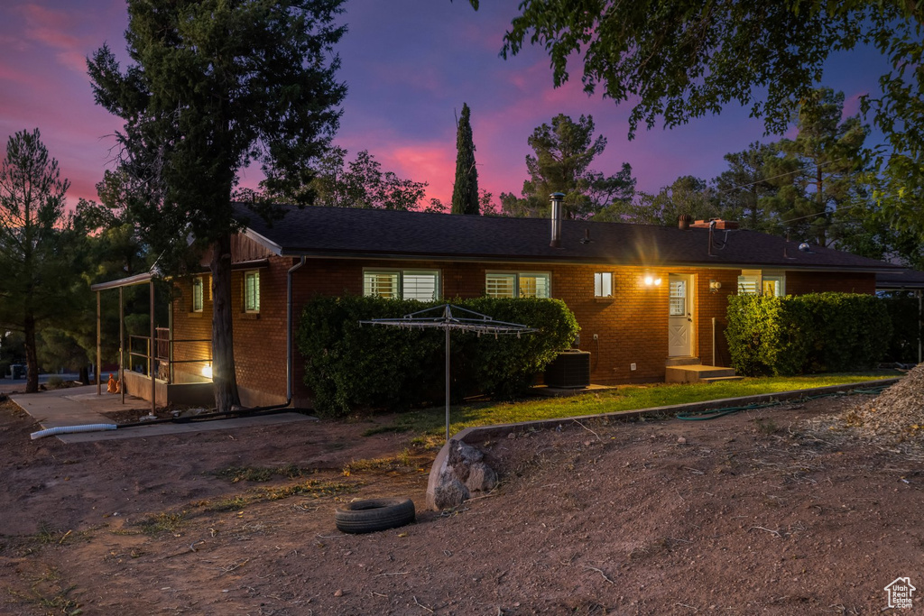 Single story home with central AC unit