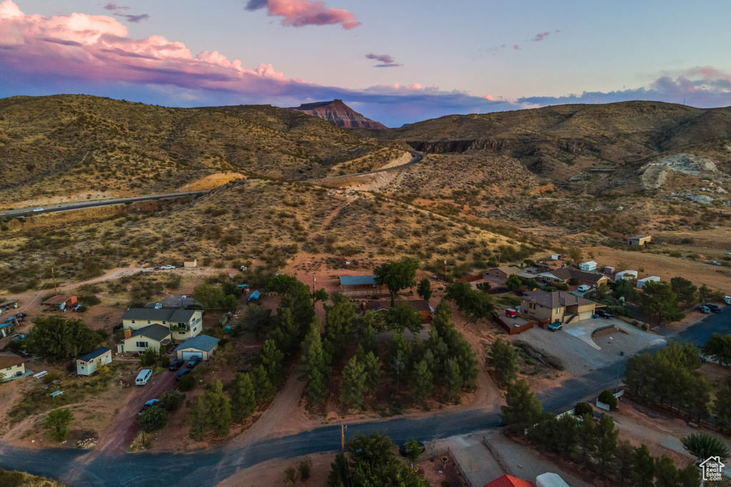 Aerial view at dusk featuring a mountain view