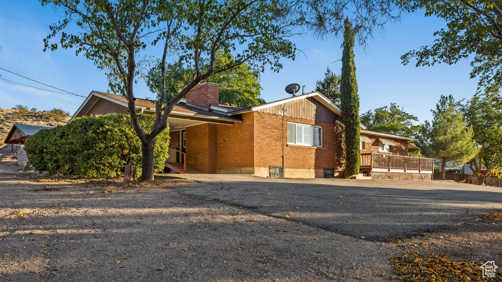 View of front of house with a carport