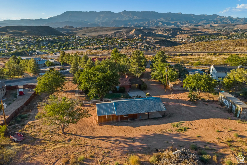 Birds eye view of property with a mountain view