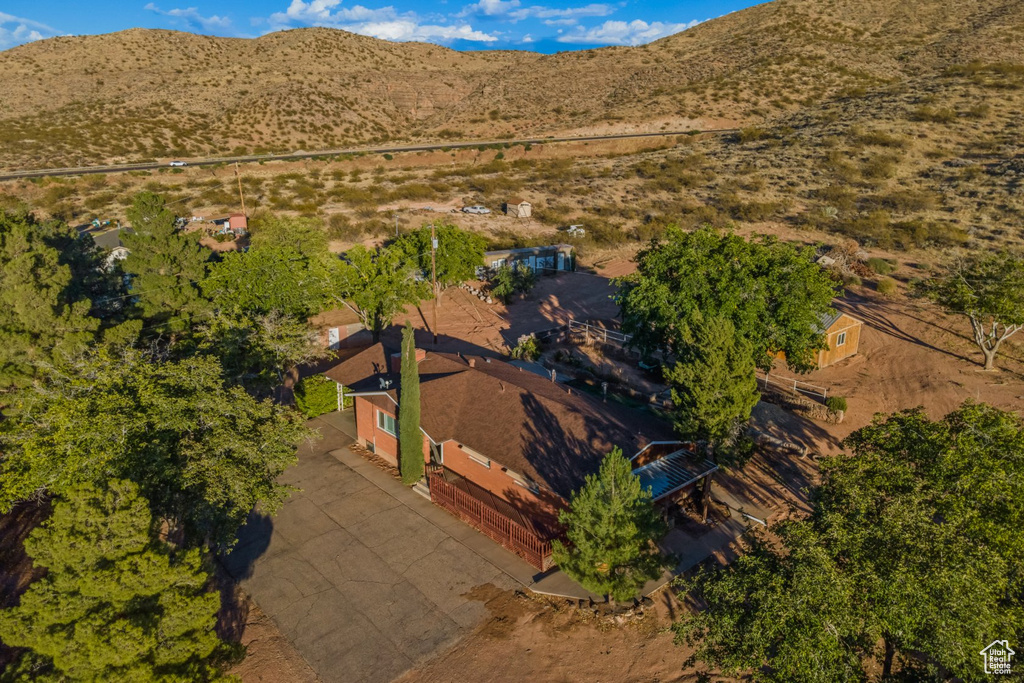 Birds eye view of property with a mountain view