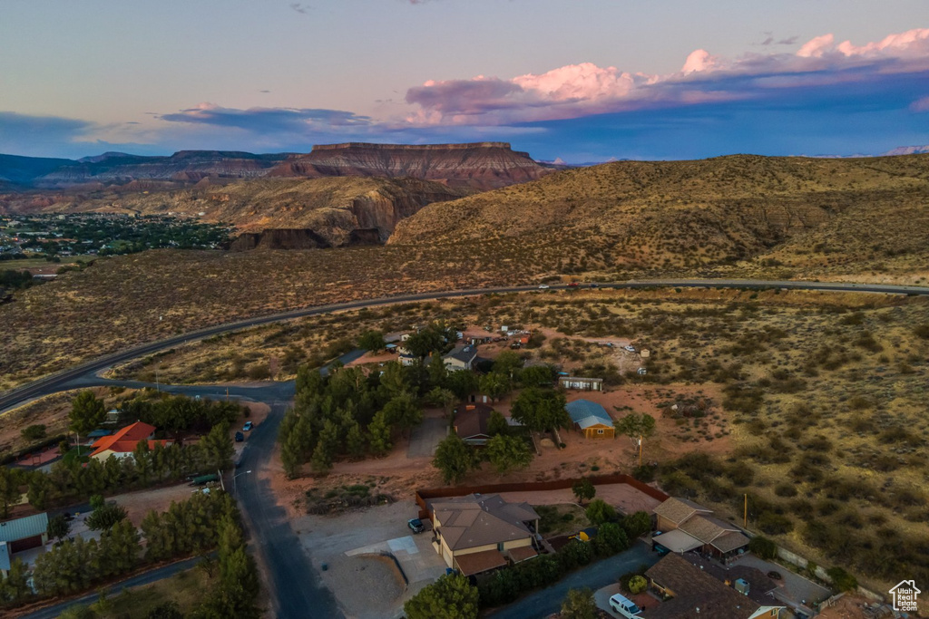 Aerial view at dusk featuring a mountain view