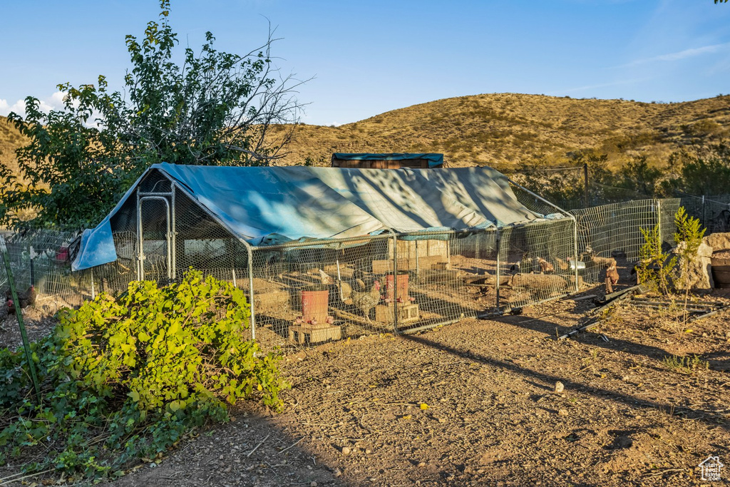 Exterior space featuring an outdoor structure and a mountain view