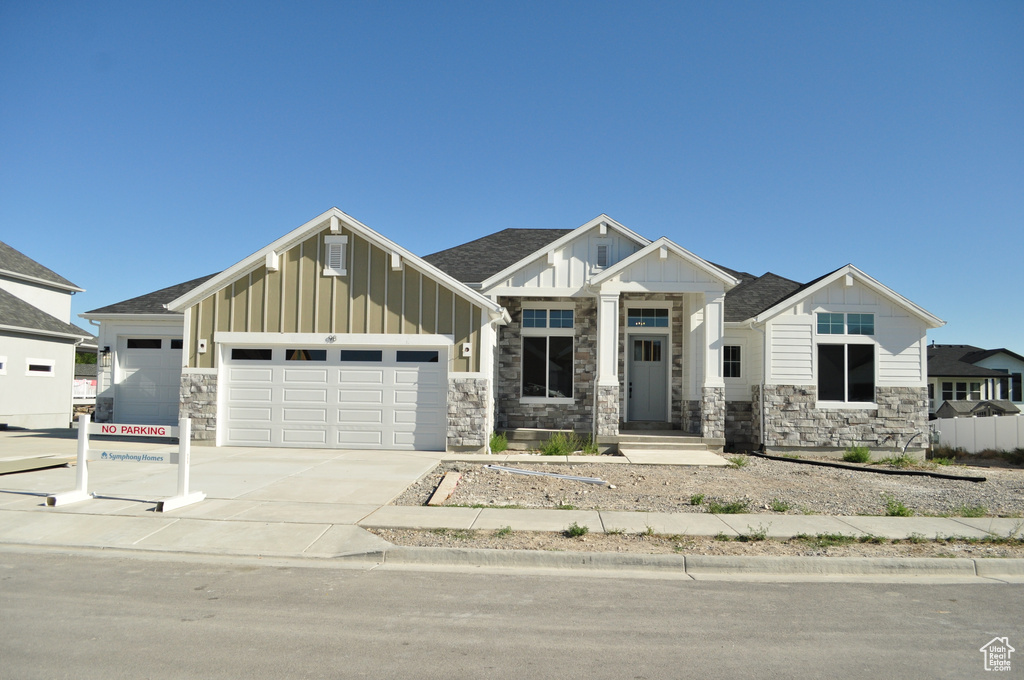 View of front facade featuring a garage