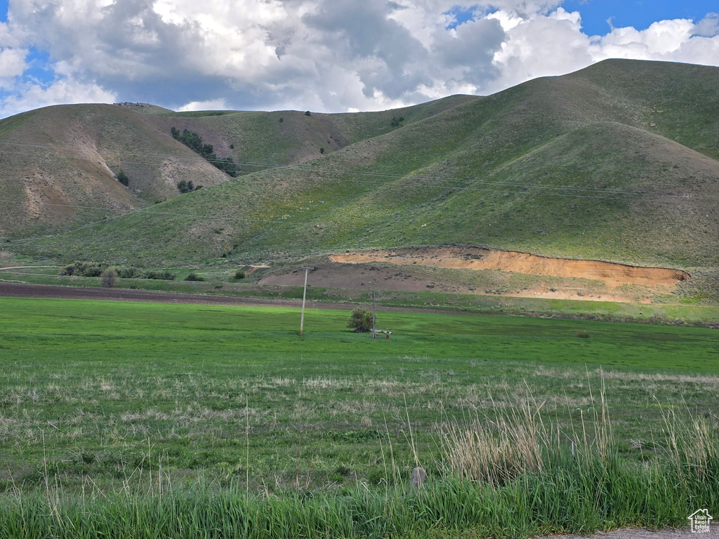 View of mountain backdrop featuring rural landscape