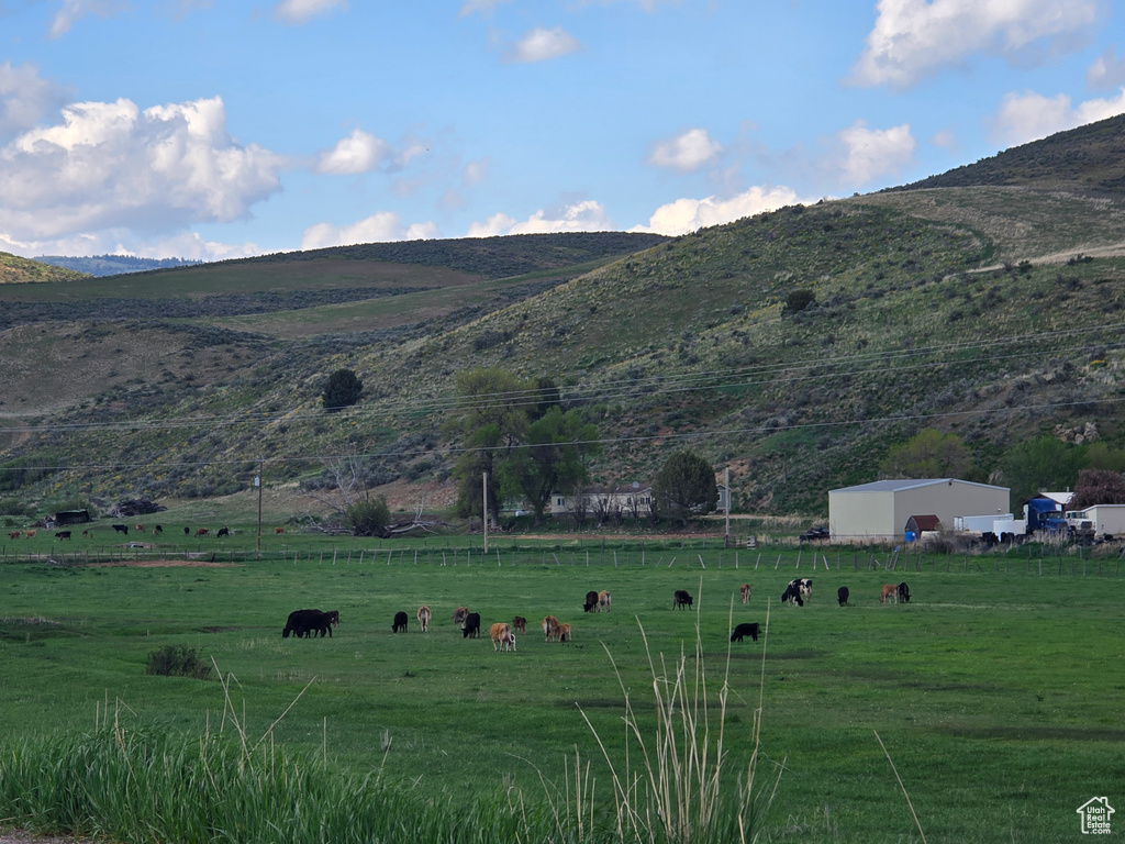 View of mountain background featuring rural landscape and a pastoral area
