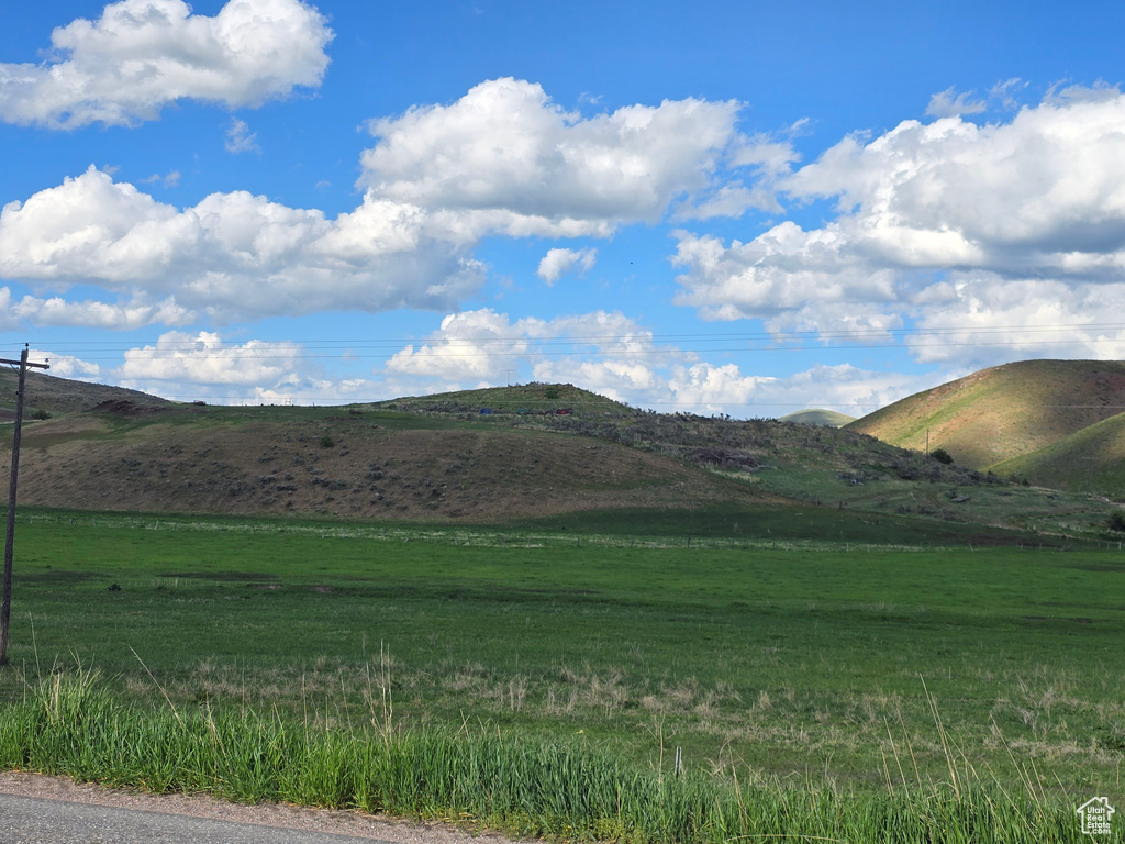 View of mountain backdrop featuring rural landscape