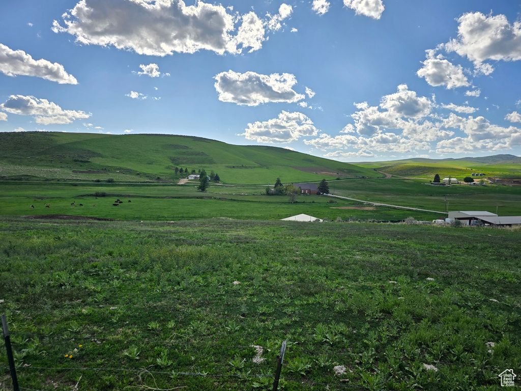 View of mountain backdrop featuring rural landscape and a pastoral area