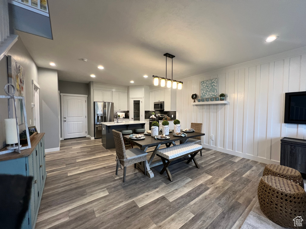 Dining area featuring sink and hardwood / wood-style floors