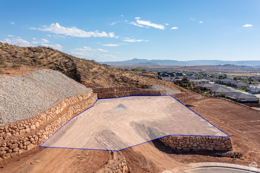 Birds eye view of property with a mountain view