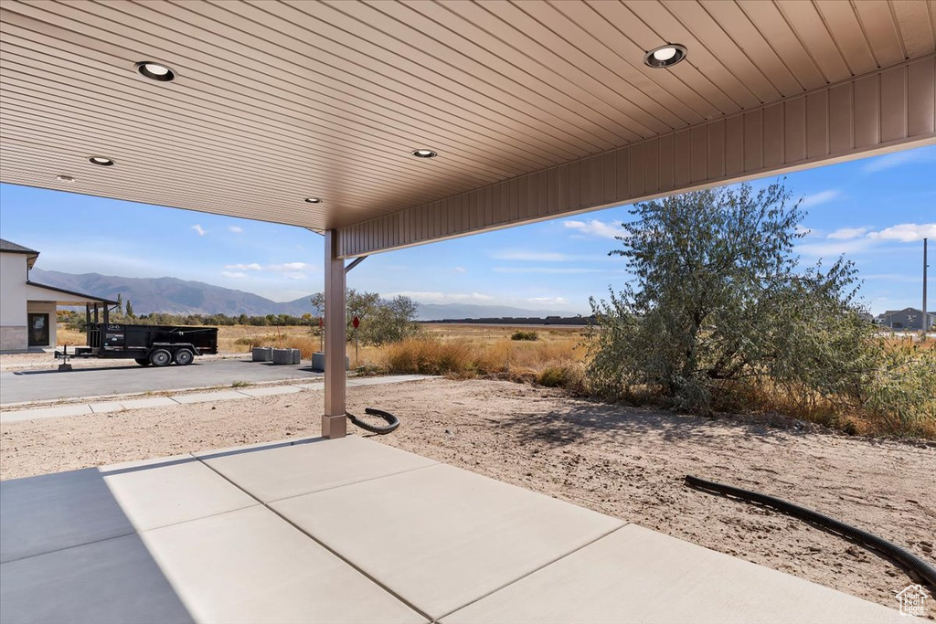 View of patio with a mountain view