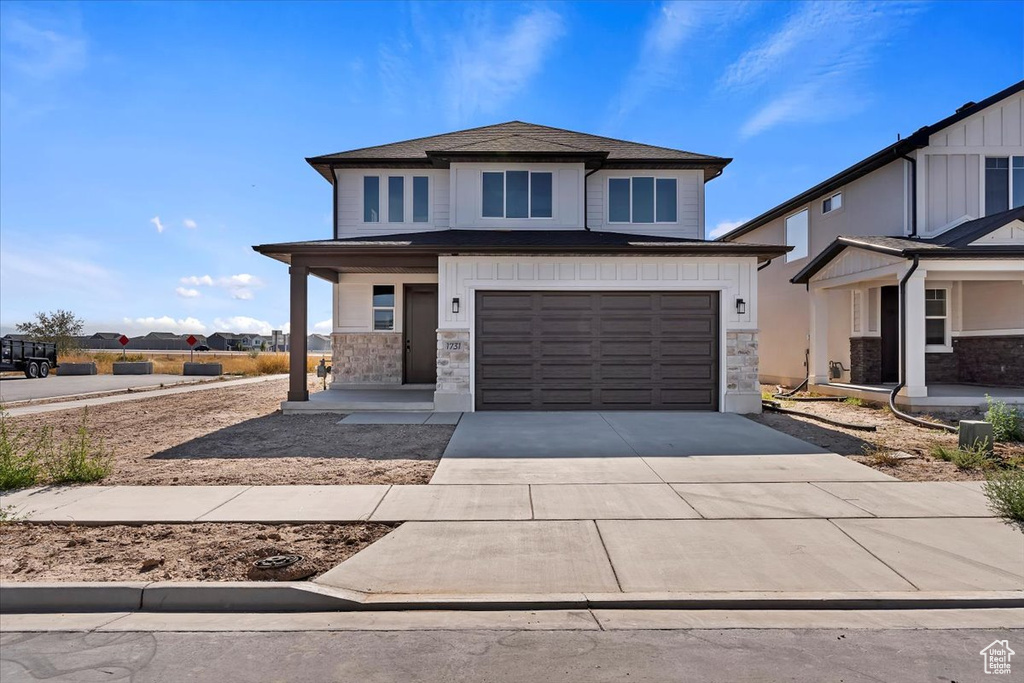 View of front of house with a garage