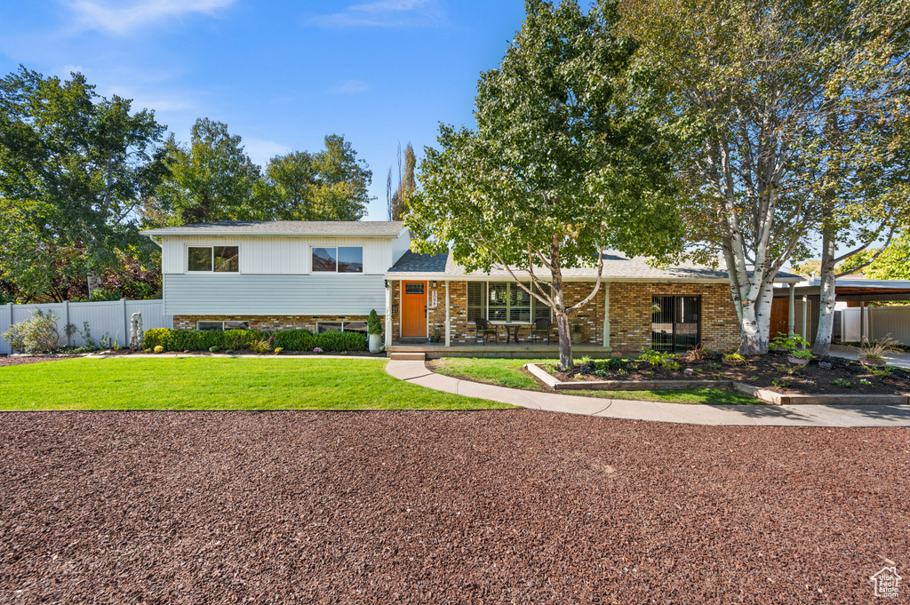 View of front of property with a front yard