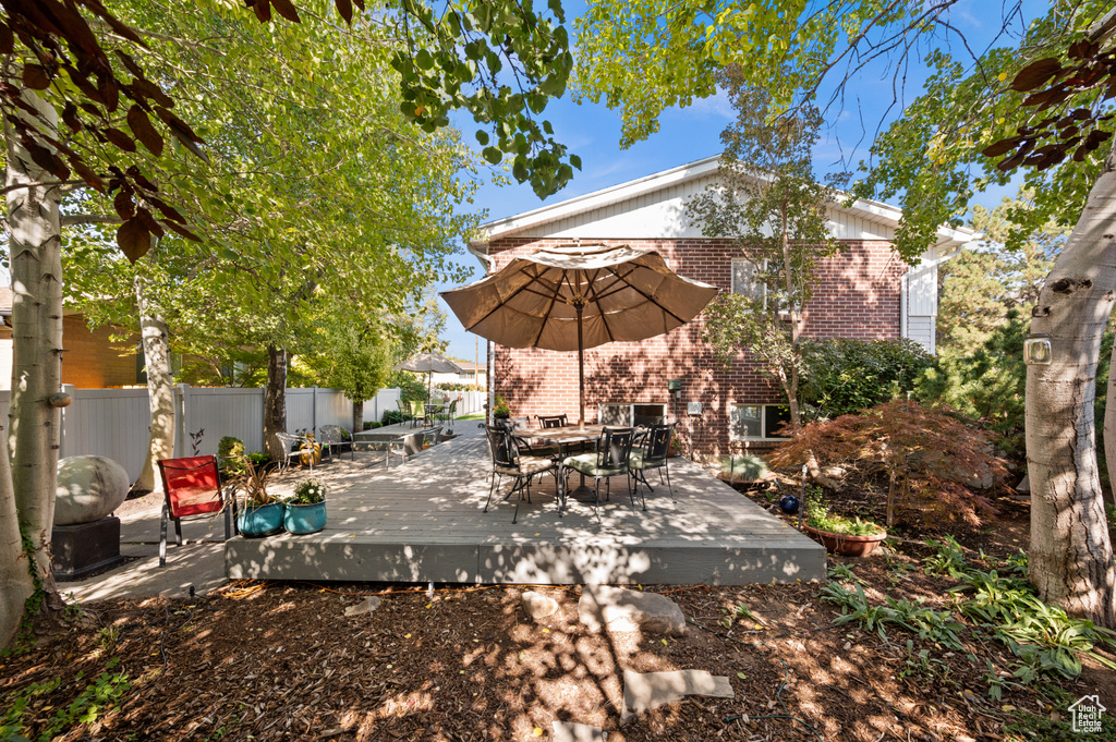 View of patio featuring a wooden deck