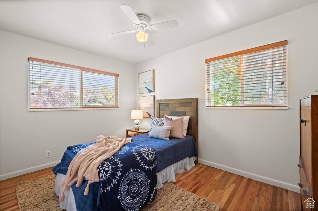 Bedroom featuring ceiling fan and hardwood / wood-style floors