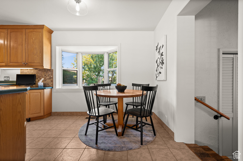 Dining room featuring light tile patterned floors