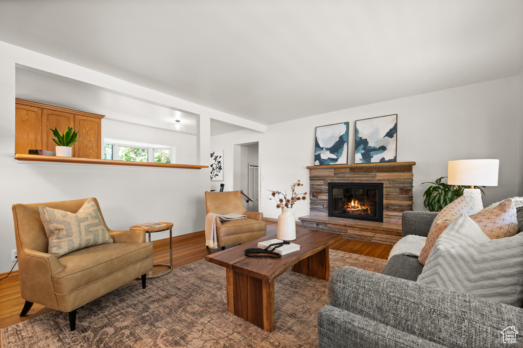 Living room featuring hardwood / wood-style flooring and a fireplace