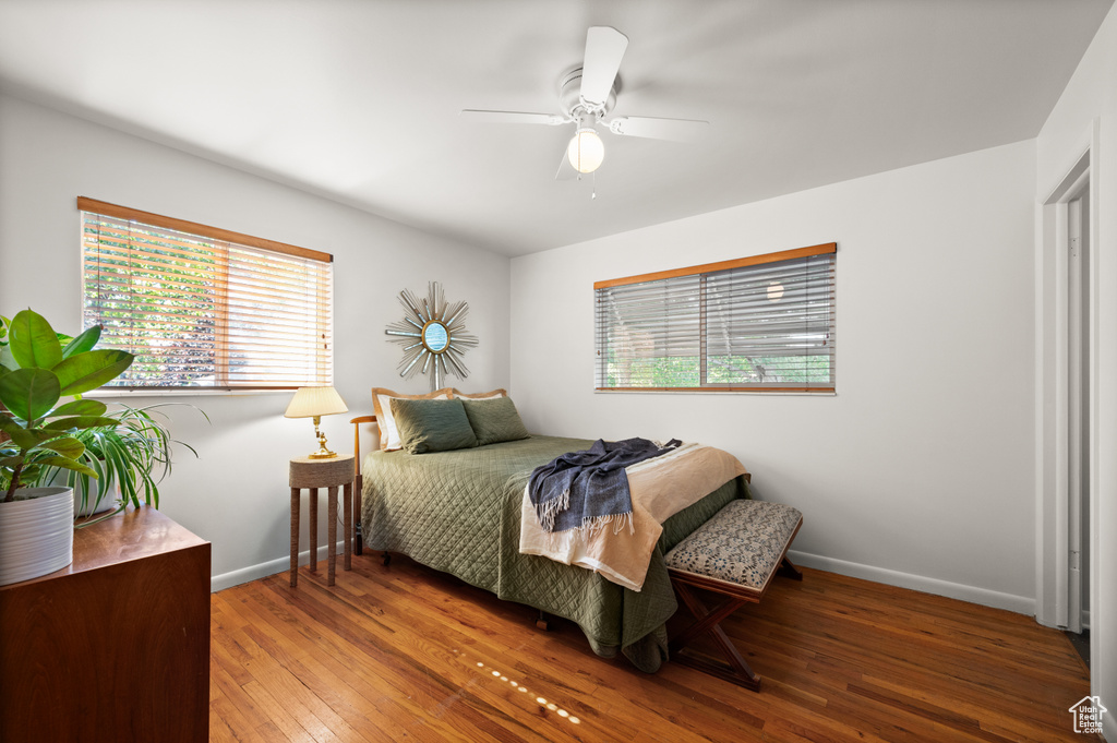 Bedroom with wood-type flooring and ceiling fan