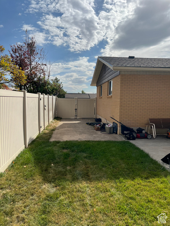 View of yard with a patio