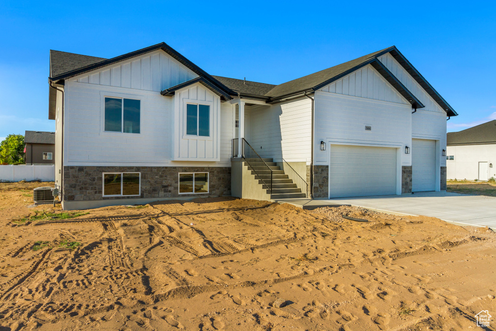 View of front of home featuring cooling unit