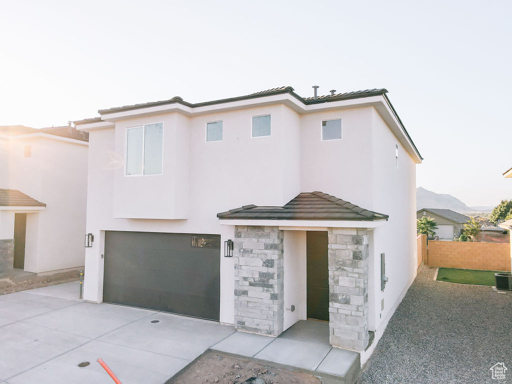 View of front of property featuring a garage