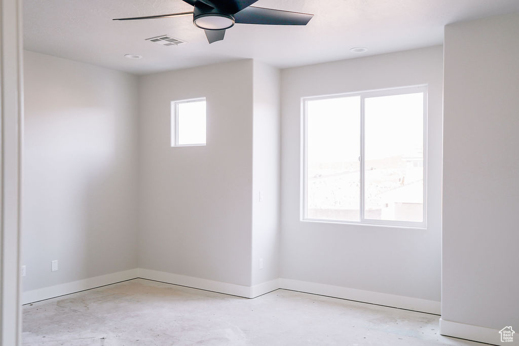 Spare room with ceiling fan