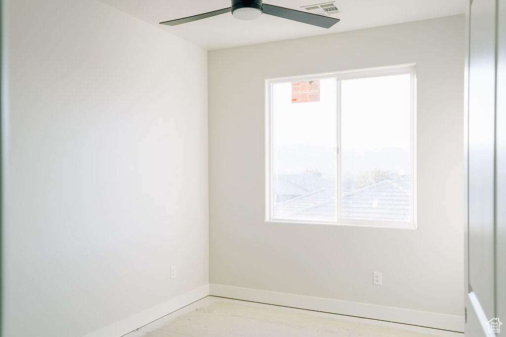 Spare room featuring ceiling fan