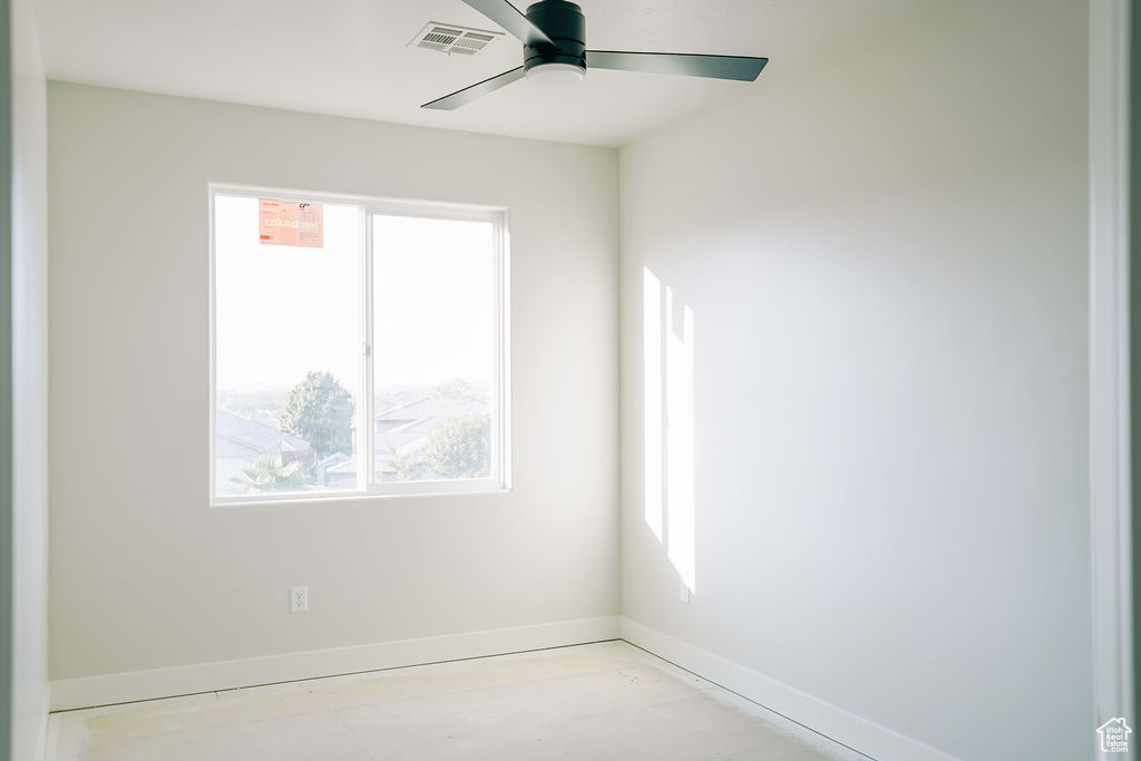 Spare room featuring ceiling fan