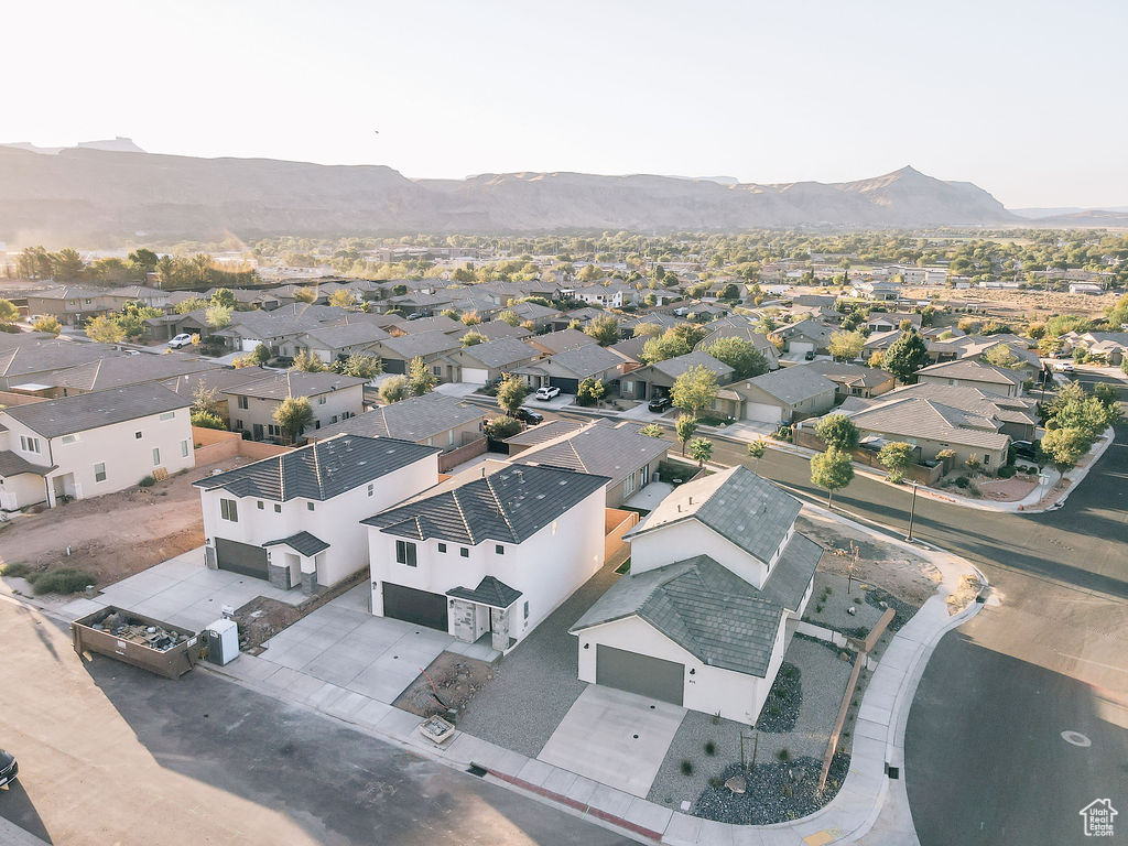 Birds eye view of property with a mountain view