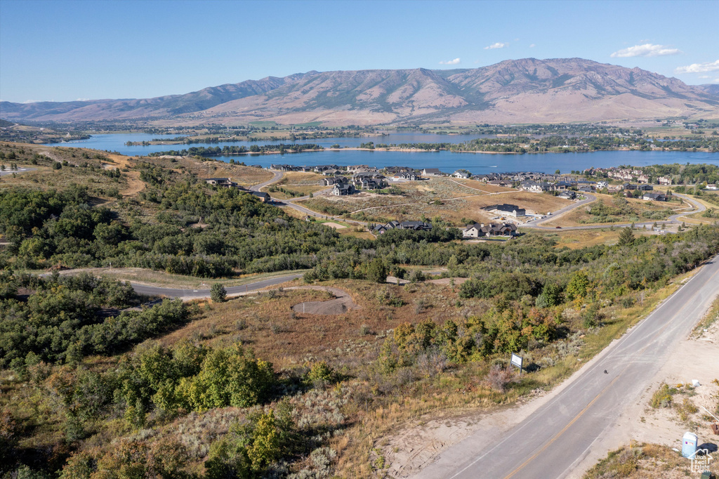 Property view of mountains featuring a water view