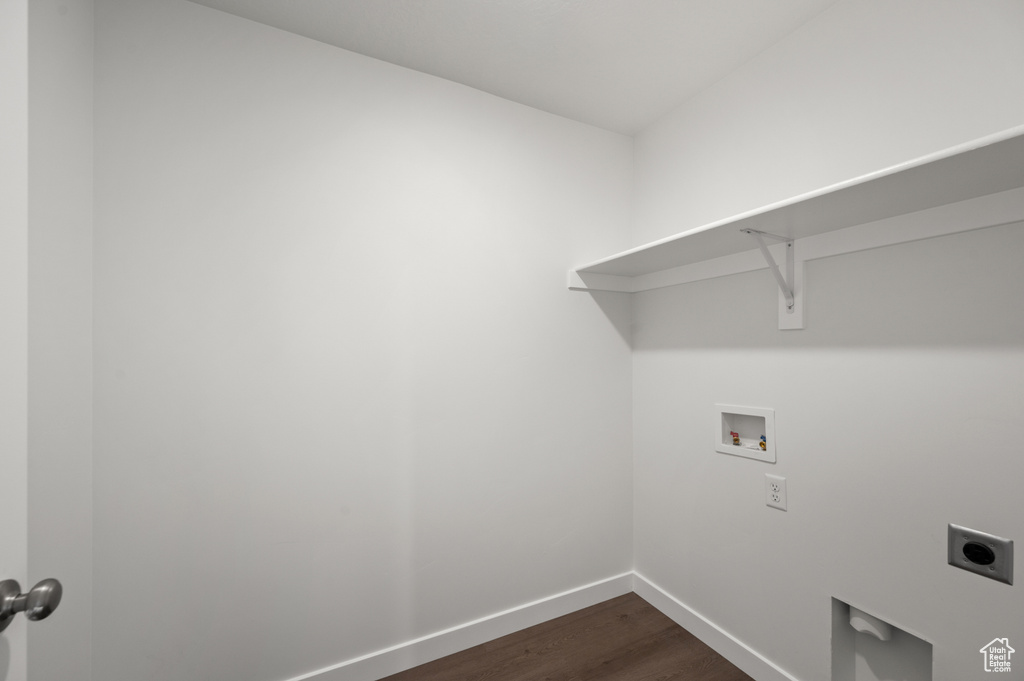 Clothes washing area featuring hookup for a washing machine, dark wood-type flooring, and electric dryer hookup