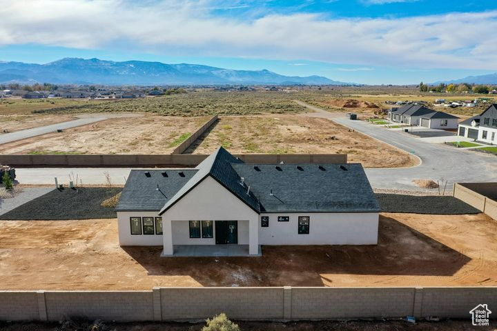 Birds eye view of property with a mountain view